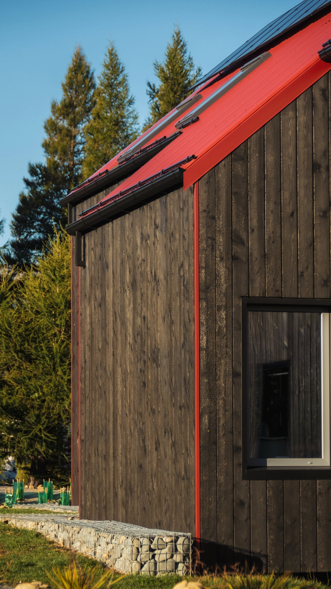 Contrasting charred Larch and red steel